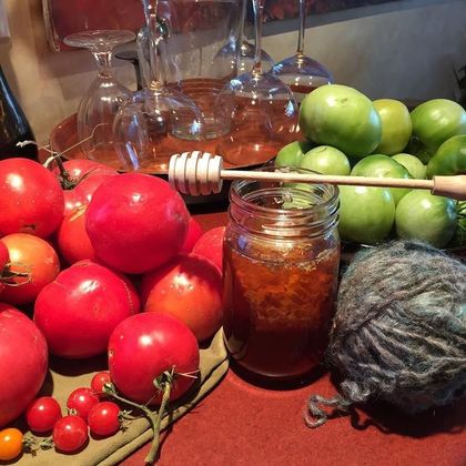 Tomatoes, a jar of honeycomb and a ball of hand-spun wool